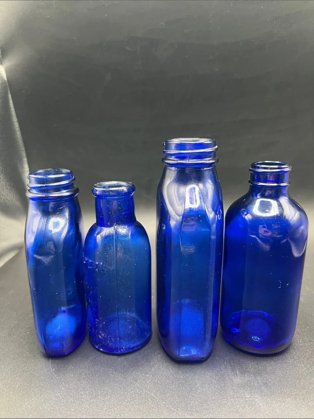Lot of 4 vintage Colbalt Blue Glass Bottles